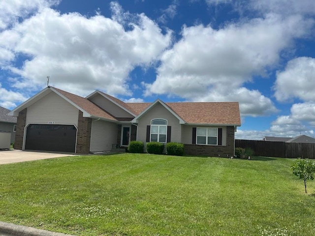 ranch-style house with a front yard and a garage