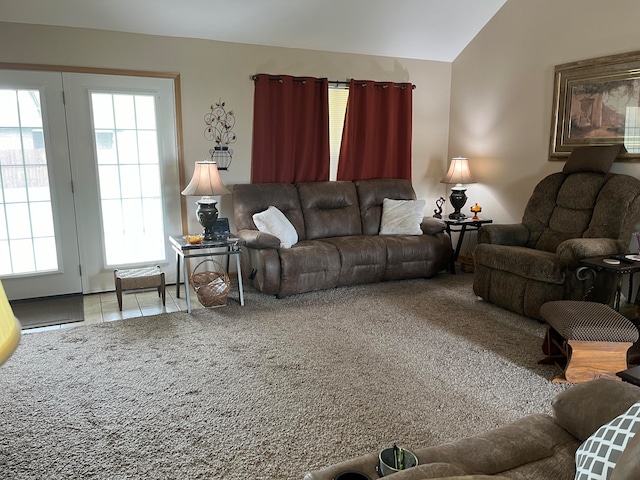 living room with lofted ceiling and carpet floors