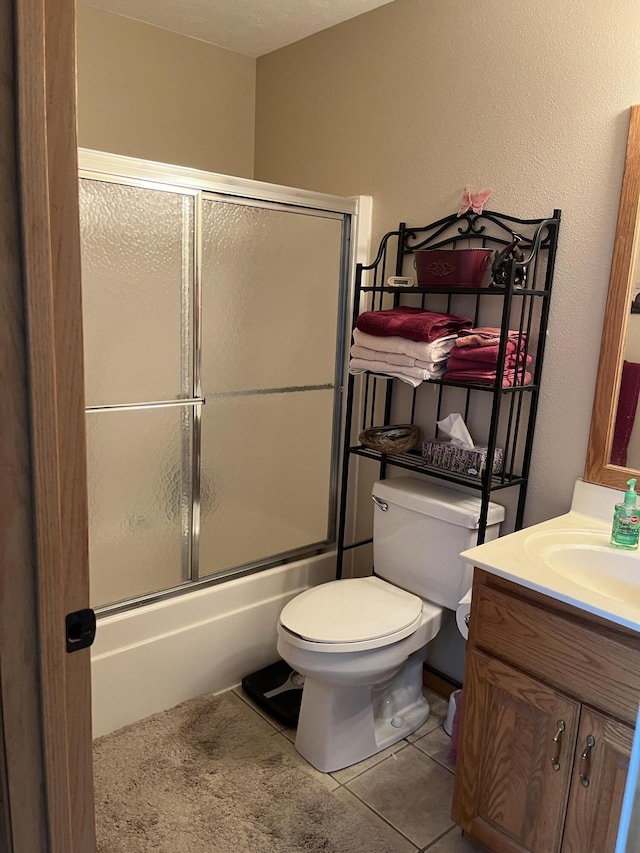 1316 E 476th Rd, Bolivar, MO 65613 - bathroom featuring enclosed tub / shower combo, toilet, vanity, and tile patterned floors