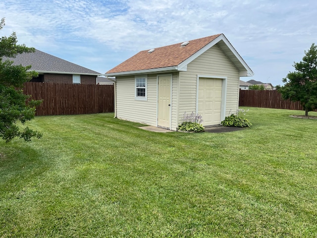 view of outbuilding with a yard