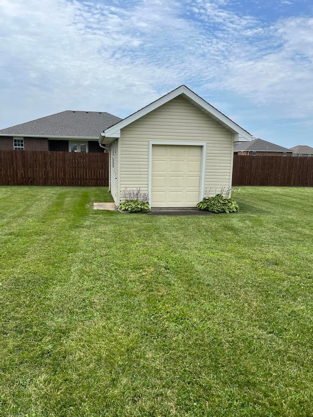 garage with wood walls and a yard