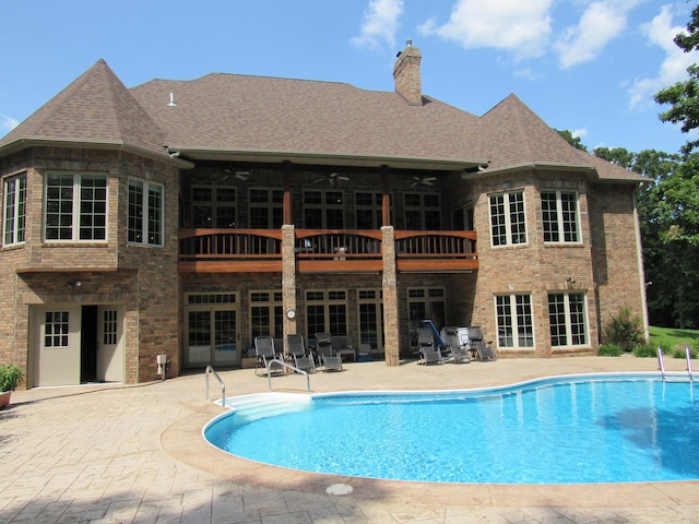 view of pool featuring a patio