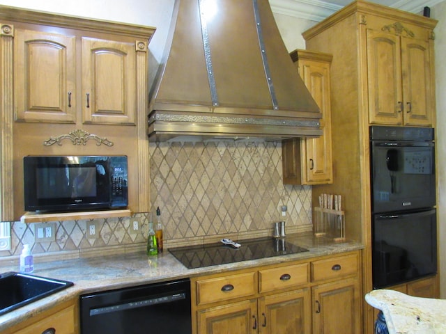 kitchen with decorative backsplash, light stone counters, custom exhaust hood, ornamental molding, and black appliances