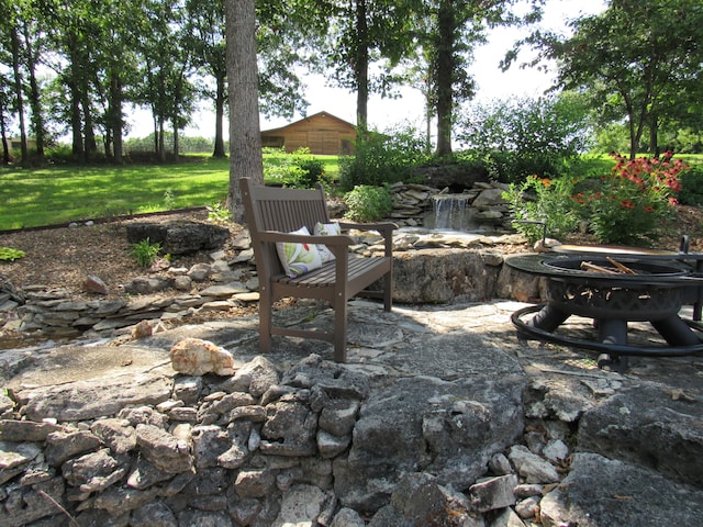 view of patio / terrace featuring a fire pit