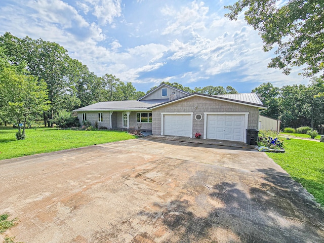 single story home with a garage and a front lawn