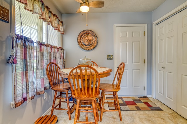 dining room with ceiling fan