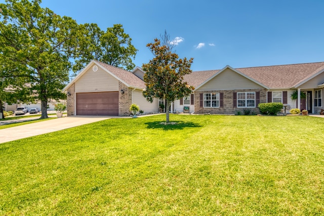 ranch-style home with a shingled roof, a front lawn, an attached garage, driveway, and brick siding