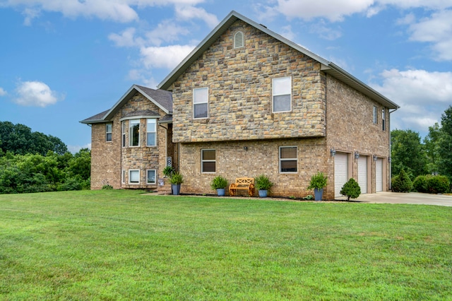 view of front of property with a garage and a front lawn