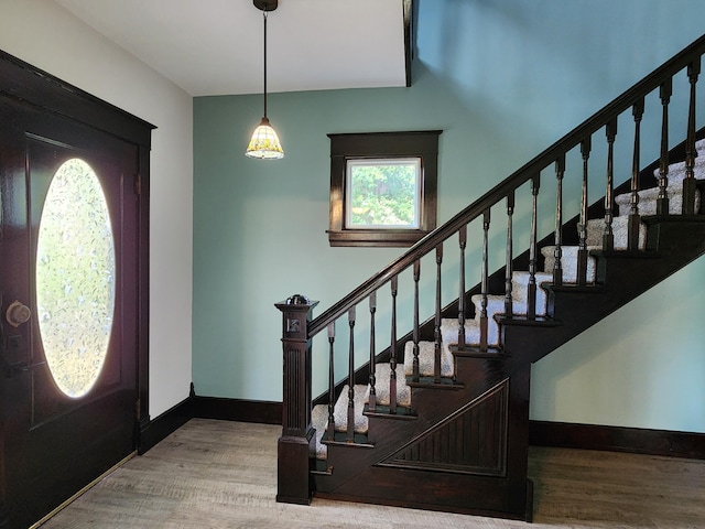 entryway with hardwood / wood-style flooring