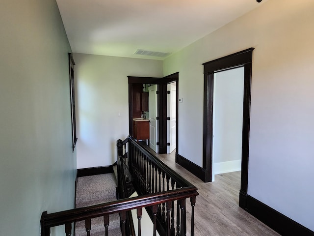 corridor featuring light hardwood / wood-style flooring