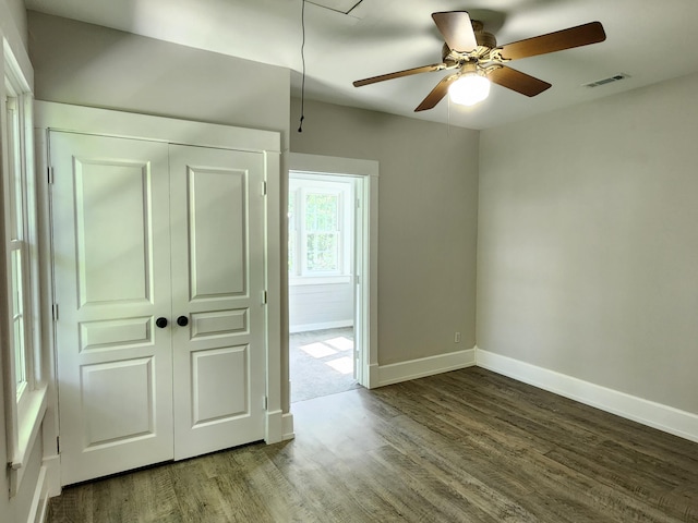 interior space featuring a closet, hardwood / wood-style floors, and ceiling fan