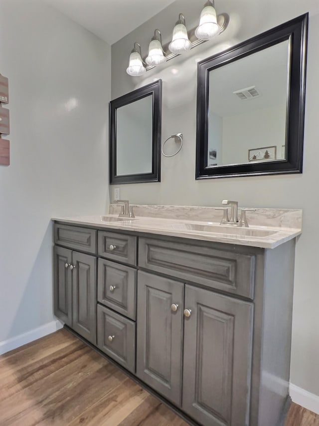 bathroom featuring vanity and hardwood / wood-style flooring