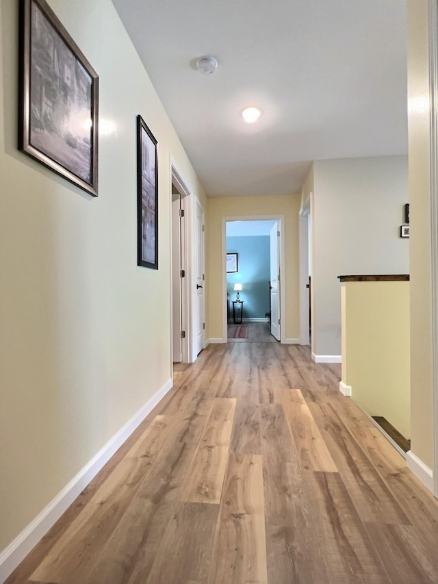 corridor featuring light hardwood / wood-style flooring