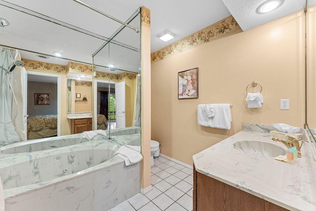 bathroom featuring vanity, a relaxing tiled tub, toilet, and tile patterned floors