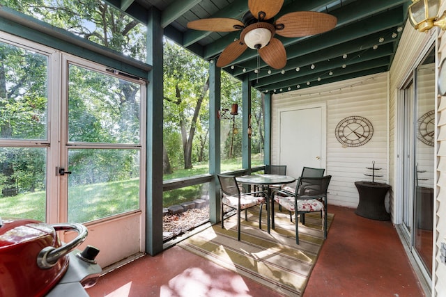 sunroom / solarium featuring ceiling fan and a healthy amount of sunlight