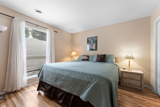 bedroom with light hardwood / wood-style flooring