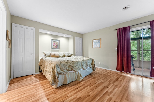 bedroom with access to outside and light hardwood / wood-style flooring