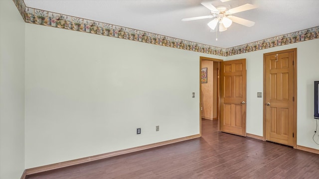 3166 W Seminole St, Springfield, MO 65807 - empty room with dark wood-type flooring, a ceiling fan, and baseboards
