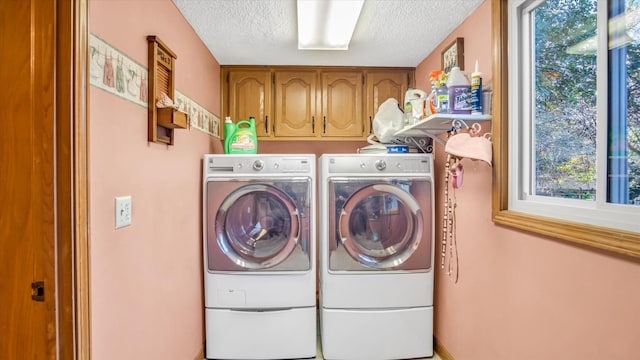 3166 W Seminole St, Springfield, MO 65807 - laundry area with washing machine and dryer, a textured ceiling, and cabinet space