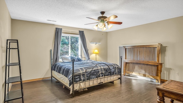3166 W Seminole St, Springfield, MO 65807 - bedroom featuring wood finished floors, a textured ceiling, baseboards, and ceiling fan