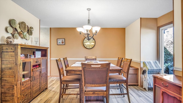 3166 W Seminole St, Springfield, MO 65807 - dining room with wood tiled floors and a chandelier