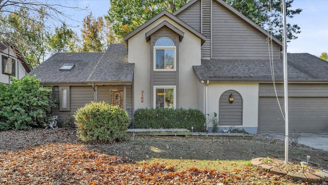 3166 W Seminole St, Springfield, MO 65807 - view of front of home with a shingled roof, stucco siding, an attached garage, and concrete driveway