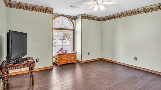 3166 W Seminole St, Springfield, MO 65807 - unfurnished room featuring ceiling fan, wood finished floors, baseboards, and a textured ceiling