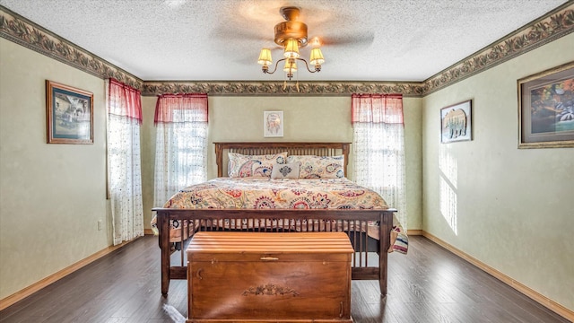 3166 W Seminole St, Springfield, MO 65807 - bedroom featuring multiple windows, a textured ceiling, hardwood / wood-style floors, baseboards, and ceiling fan