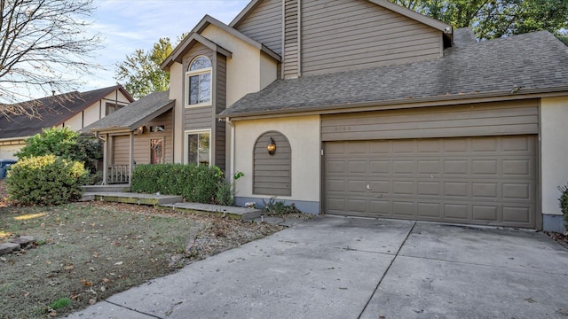 3166 W Seminole St, Springfield, MO 65807 - view of front of property with roof with shingles, driveway, and stucco siding