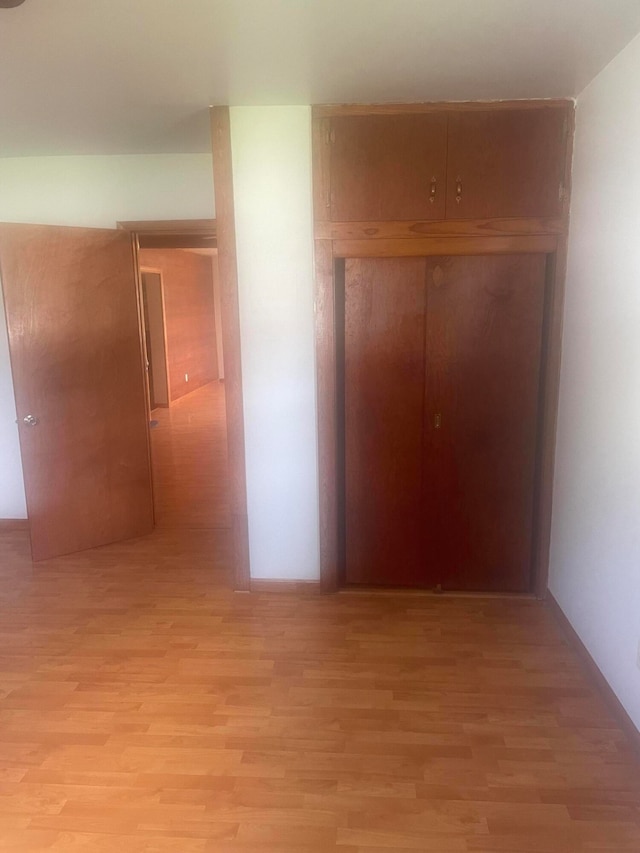 hallway with light wood-type flooring