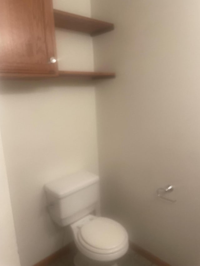 bathroom featuring toilet