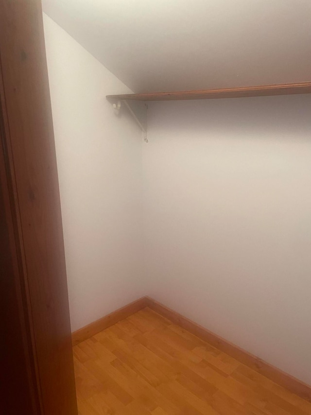 walk in closet featuring light hardwood / wood-style flooring