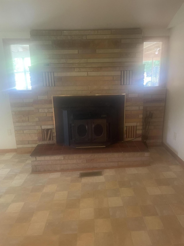 details featuring baseboards, tile patterned floors, and visible vents