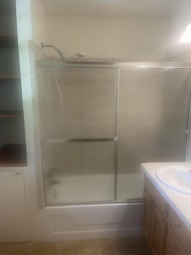 full bath featuring vanity and enclosed tub / shower combo