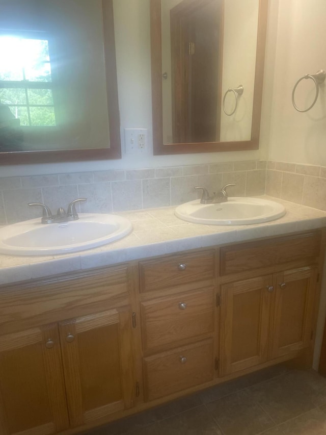 full bath featuring a sink and double vanity