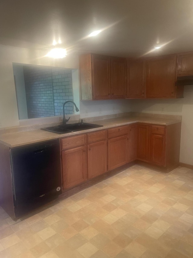 kitchen featuring light floors, light countertops, dishwasher, a sink, and brown cabinetry