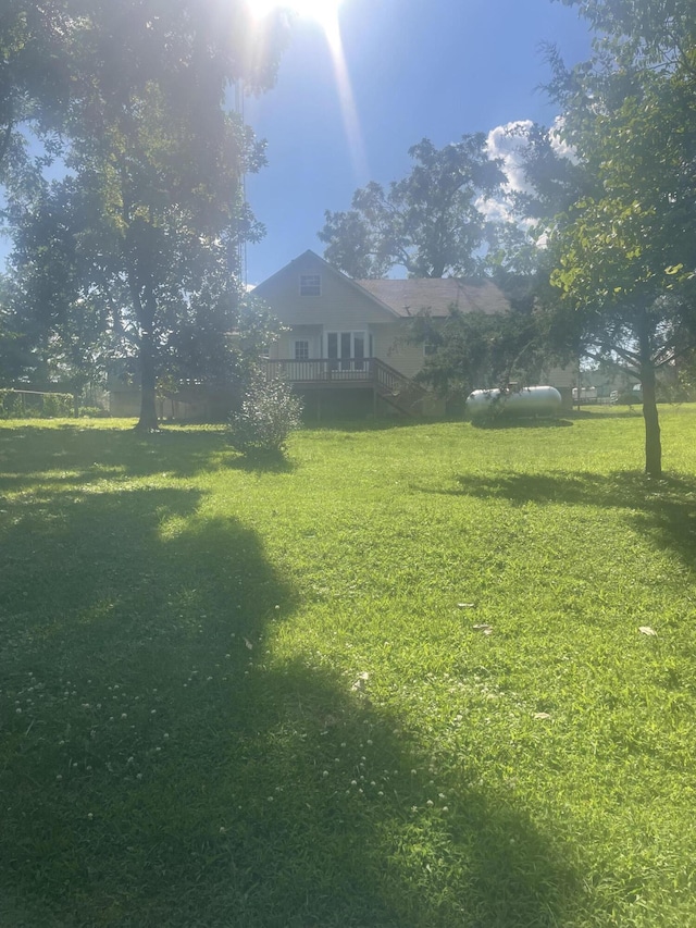 view of yard with a wooden deck