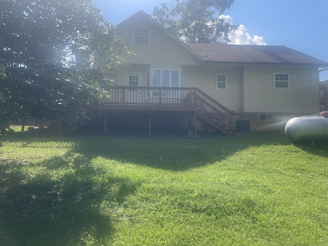 rear view of house featuring a lawn, stairs, cooling unit, and a deck