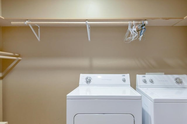 laundry area with washing machine and clothes dryer