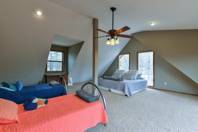 bedroom featuring vaulted ceiling, carpet, and ceiling fan