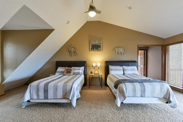 bedroom with lofted ceiling, ceiling fan, and carpet