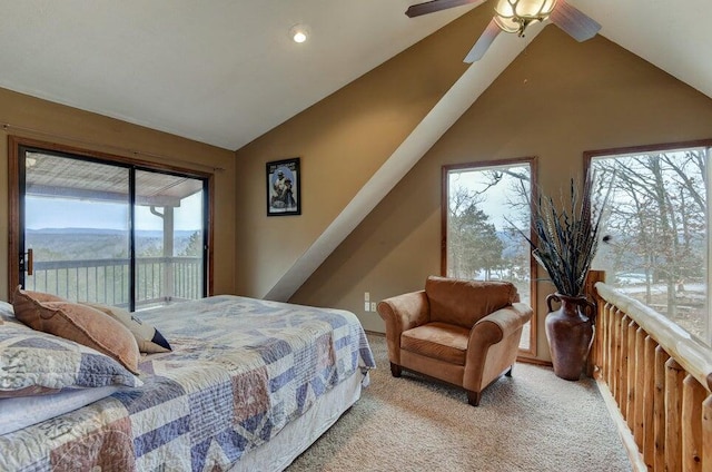 carpeted bedroom featuring access to exterior, a mountain view, ceiling fan, and lofted ceiling