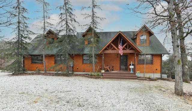 cabin featuring cooling unit and covered porch