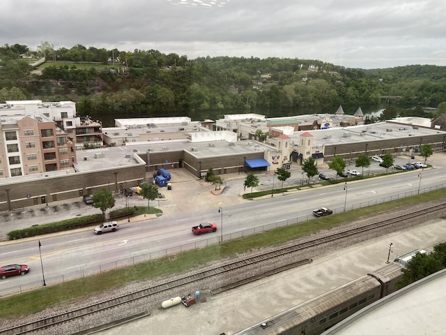 birds eye view of property featuring a wooded view