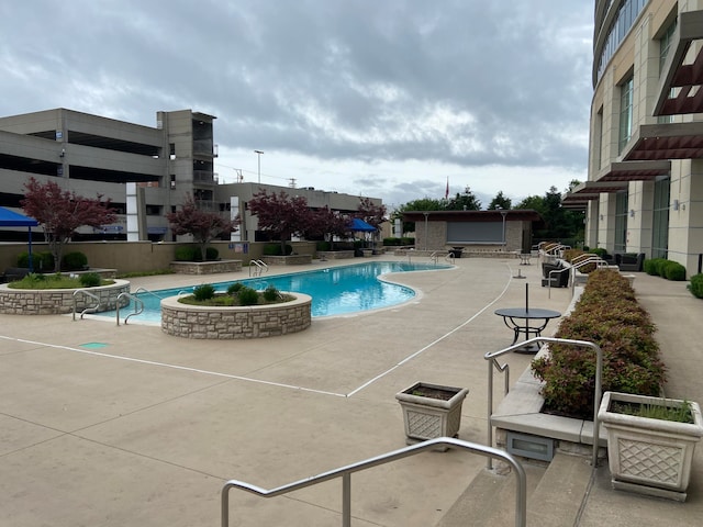 view of swimming pool with a patio