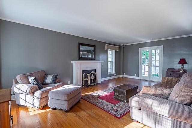 1011 E University St, Springfield, MO 65807 - living area with wood finished floors, ornamental molding, and a fireplace with flush hearth