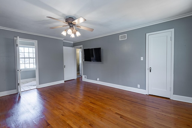 1011 E University St, Springfield, MO 65807 - unfurnished room with a ceiling fan, wood finished floors, and crown molding