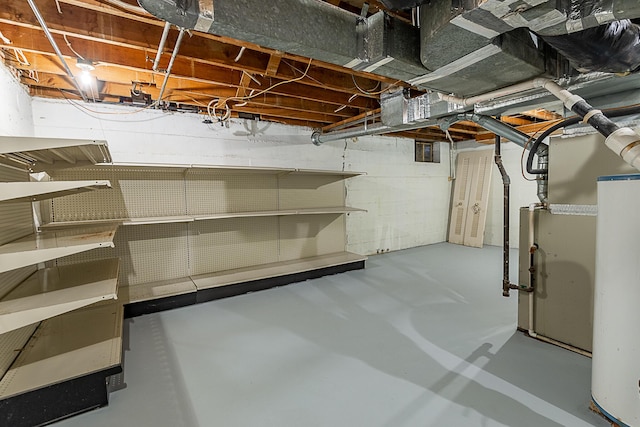 1011 E University St, Springfield, MO 65807 - unfinished below grade area featuring water heater
