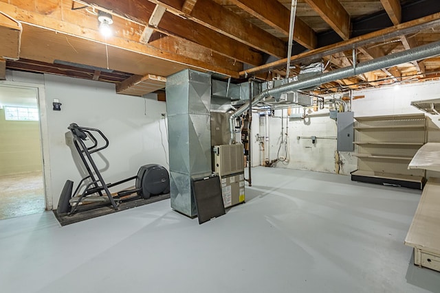 1011 E University St, Springfield, MO 65807 - below grade area featuring heating unit and electric panel