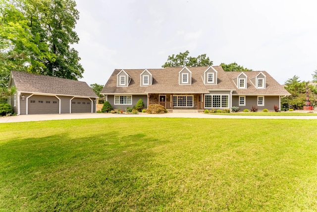 new england style home featuring a garage and a front yard